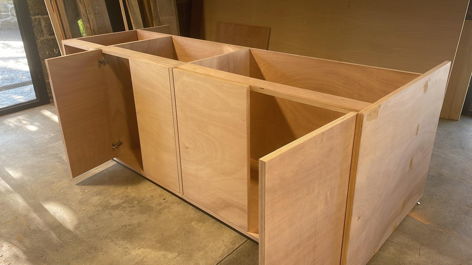 a wood box with a metal handle